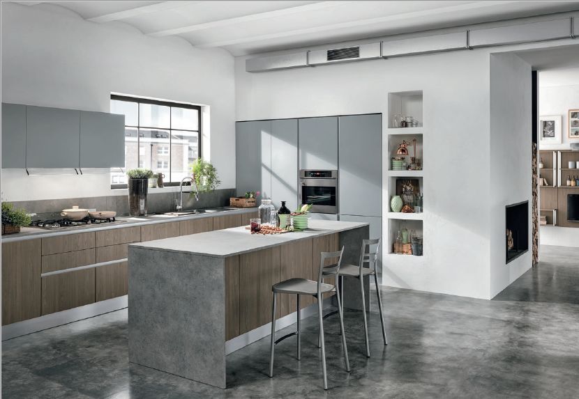 Cucina con isola su pavimento in cemento